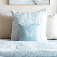 light blue linen pillow case on bed