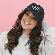 girl wearing black vintage wash monogrammed baseball hat