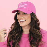 girl wearing hot pink monogrammed vintage wash baseball cap