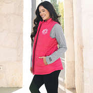 girl wearing monogrammed gray long sleeve crewneck shirt with puffer vest