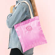 girl with personalized shimmer tote bag in pink over shoulder