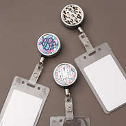 set of 3 badge reels on brown