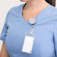 nurse with monogrammed coral floral badge reel