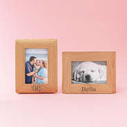two personalized photo frames on pink
