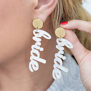 girl wearing bride earrings