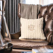 ivory cable knit pillow sham on chair