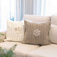 two cable knit pillow shams on couch