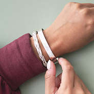 monogrammed bangle set in silver on wrist