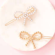 front and back of pearl bow barrettes