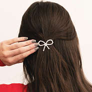 pearl bow barrette in hair