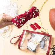 crimson football headband in hand