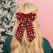 girl wearing christmas velvet bow back closeup