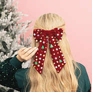 girl wearing christmas velvet bow back