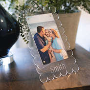 family photo in scalloped picture frame with plants