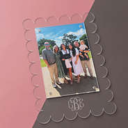 monogrammed graduation photo in scalloped picture frame
