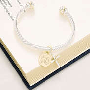 cable cross bracelet on bible