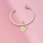 cable cross bracelet on pink