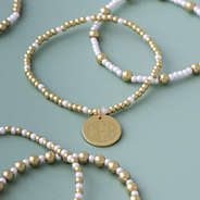 pearl gameday bracelet stack on sage background