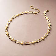 gold pearl starburst necklace studio shot