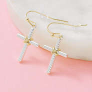 cable cross earrings on pink