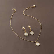 pave cable necklace and earrings on brown