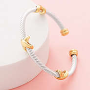 close up of silver and gold cable bangle