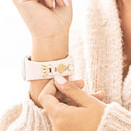 monogrammed bow smartwatch charm set in gold on wrist