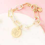 mixed metal chainlink bracelet on marble dish