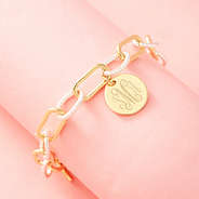 mixed metal chainlink bracelet on pink background