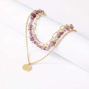 monogrammed triple layer necklace on white background