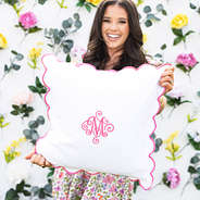 pink scalloped pillow sham in hands