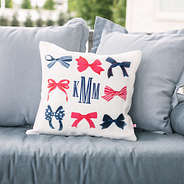monogrammed bows fourth of july pillow on couch