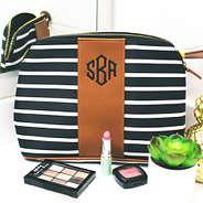 monogrammed striped cosmetic bag on bathroom counter