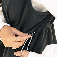 close up of black sweatshirt vest