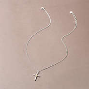 cable cross necklace on brown