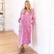 girl wearing monogrammed pink bows xl blanket hoodie with moccasins