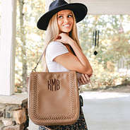 girl carrying whipstitch hobo purse over shoulder