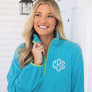 girl wearing monogrammed aruba puff sleeve fleece pullover up close