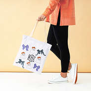 ghost halloween bag in hand orange background