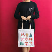 girl holding christmas bag front