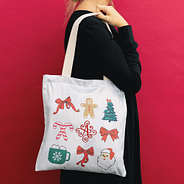 girl holding christmas bag side