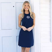 girl wearing monogrammed scalloped exercise dress in navy