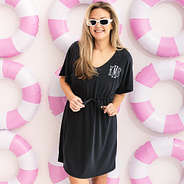 girl wearing personalized cinch waist cover up in black with beach floaties