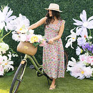 girl with bike wearing floral trellis smocked dress