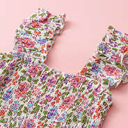 up close of smocked dress in flora trellis