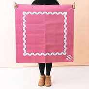 Girl holding up mahjong mat