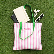 pink and green striped tote flatlay