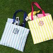 blue and yellow striped totes on grass