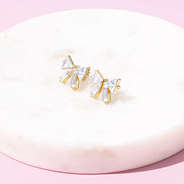 crystal bow earrings on marble