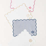 group of 4 scalloped placemats